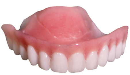 Upper dentures isolated on white background