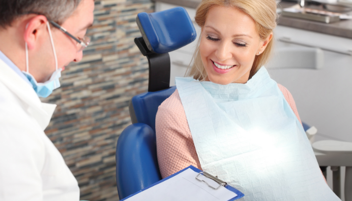 Dental implant candidate receives in person consultation with surgeon